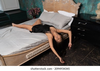 Strangled beautiful asian woman in a bedroom. Simulation of the crime scene.



















