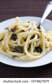 Strangozzi or Stringozzi is a typical handmade pasta made in the Umbria region in Italy