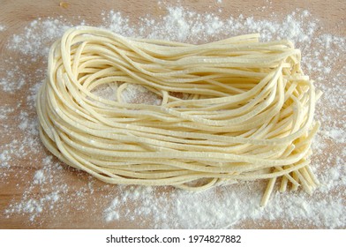 Strangozzi or Stringozzi is a typical handmade pasta made in the Umbria region in Italy