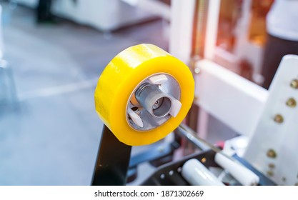 Strapping Machine for Industrail Packaging Line, Modern machine for packaging line in factory, Industrial and technology concept.