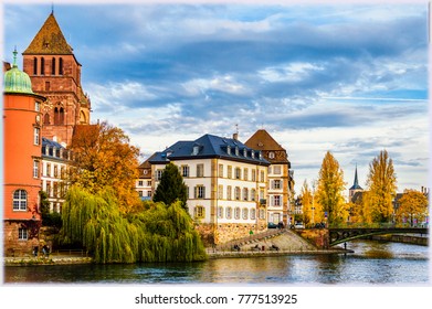 Strasbourg In Autumn Colors. View On St Thomas Church Across The Channel