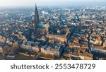 Strasbourg, the capital of Christmas, sparkles during Advent, with its stunning decorations and festive ambiance. This aerial view features the majestic Strasbourg Cathedral, La Petite France 