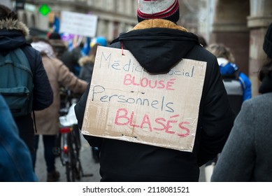 Strasbourg - France - 1 February 2022 - people protesting with placard and text in french : medico social blousés, personnels blasés, traducin in english : medico social defrauded, jaded staff