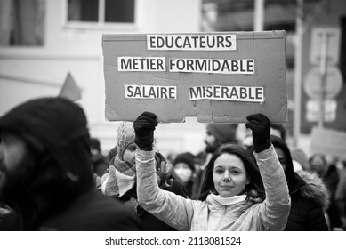 Strasbourg - France - 1 February 2022 - People Protesting With Placard And Text In French : Educateur Metier Formidable Salaire Miserable, Traduction In English : Educator, Great Job, Miserable Salary
