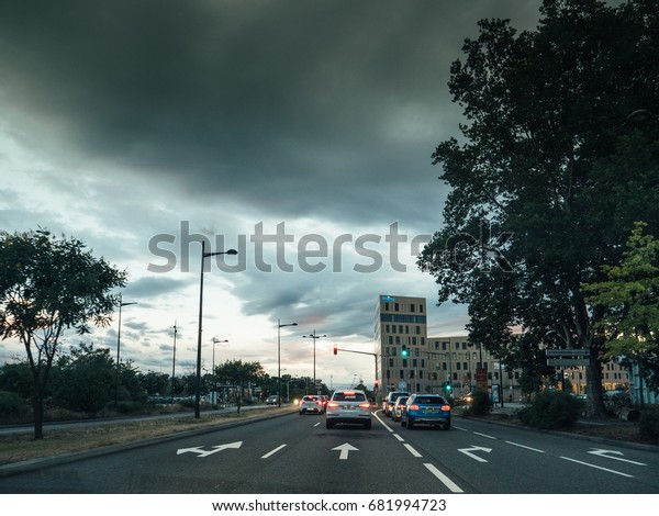 STRASBOURG, FRANCE - 30 jun 2017: Entrance to Strasbourg\
from Germany with the RHENA hospital clinic and scary clouds above\
the city 