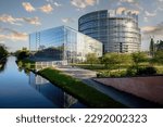 Strasbourg, France - Apr 23, 2017: Fantastic view of European Parliament headquarters view from the Freedom bridge with reflection in Ill river and all Eu Members flags waving