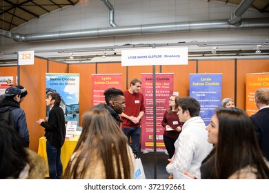 STRASBOURG, FRANCE - FEB 4, 2016: Children and teens of all ages attending annual Education Fair to choose career path and receive vocational counseling - Lycee Sainte Clotilde