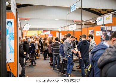 STRASBOURG, FRANCE - FEB 4, 2016: Children And Teens Of All Ages Attending Annual Education Fair To Choose Career Path And Receive Vocational Counseling - Rows Of College Stands