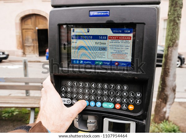 STRASBOURG, FRANCE - JAN\
27, 2018: Pay for parking in France on street in Strasbourg digital\
touchscreen 