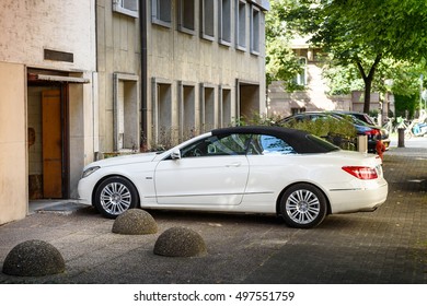 STRASBOURG, FRANCE - JUL 4, 2016: Luxury Mercedes-Benz CLK Convertible Car Entering Through Garage Door In Modern Calm City