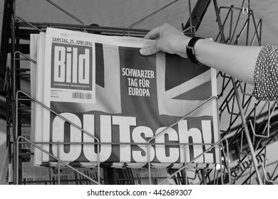 STRASBOURG, FRANCE - JUN 25, 2016: Woman Buying Bild Magazine Newspaper With Shocking Headline Titles At Press Kiosk About The Brexit Requesting To Quit The European Union