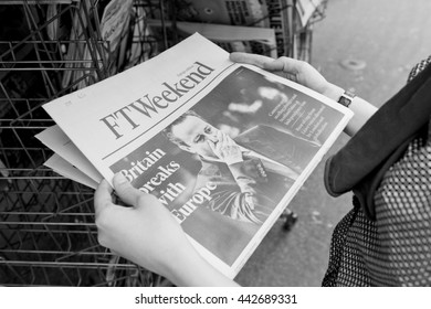 STRASBOURG, FRANCE - JUN 25, 2016: Woman Buying Financial Times Newspaper With Shocking James Cameron PM Headline Titles At Press Kiosk About The Brexit Referendum To Quit The European Union