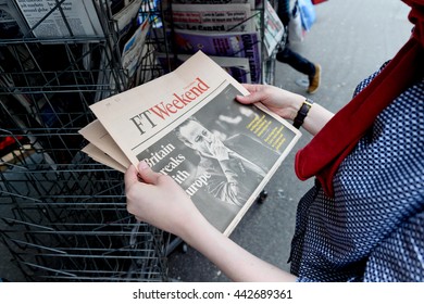 STRASBOURG, FRANCE - JUN 25, 2016: Woman Buying Financial Times Newspaper With Shocking James Cameron PM Headline Titles At Press Kiosk About The Brexit Referendum To Quit The European Union