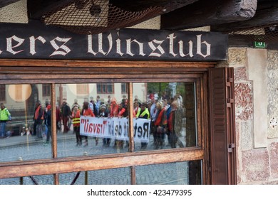 STRASBOURG, FRANCE - MAY 19, 2016: Reflection Of Protesters In Winstub Restaurant During A Demonstrations Against Proposed French Government's Labor And Employment Law Reform