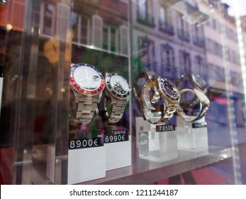 STRASBOURG, FRANCE - MAY 2, 2018: Multiple Rolex Sports Watches, Including The GMT Master And Submariner, On Display At A Vintage Watch Dealer. Luxury Swiss Timepiece Industry.