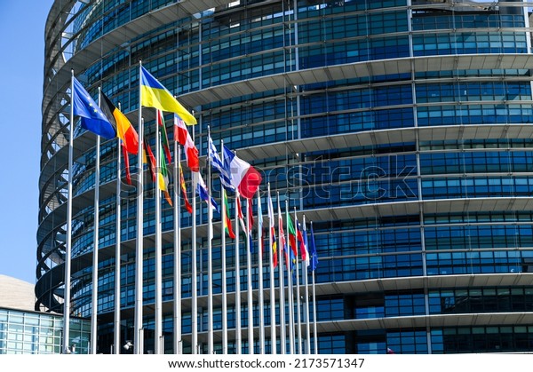 Strasbourg, France, May 2022: Flags of\
EU members countries in front of The European Parliament. Building\
of EU Parliament. Institutions of European Union.\
