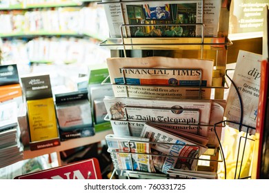 STRASBOURG, FRANCE - NOV 21, 2017: Newspaper Stand With Financial Times, The New York Times Featuring News About Merkel And Mugabe