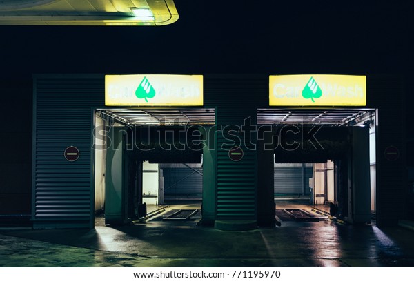 STRASBOURG,\
FRANCE - NOV 29, 2017: AGIP Gas station in France at night with Car\
Wash entrance for the automatic car\
cleaner