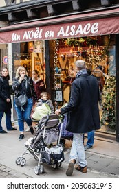 Strasbourg, France - Oct 28, 2017: Rear View Of People Customers Visiting The Un Noel En Alsace Christmas Store During Annual Winter Holiday