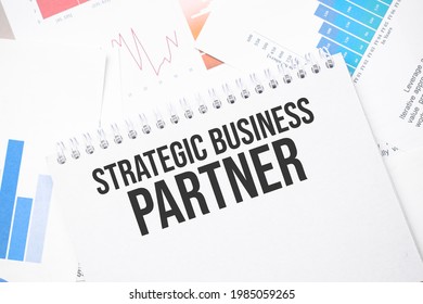 Strategic Business Partner Text On Paper On The Chart Background With Pen