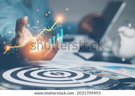 strategic goals stock market business growth success concept Businessmen showcasing growing stocks of virtual holograms. Invest in online trading technology.
