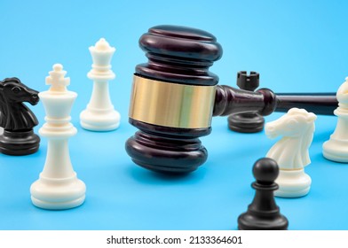 Strategic Lawsuit Settlement, Develop Legal Strategy And Planning Court Challenge Concept With Judge Gavel And Chess Pieces Isolated On Blue Background