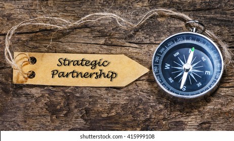 Strategic partnership - business tips handwriting on label with compass - Shutterstock ID 415999108