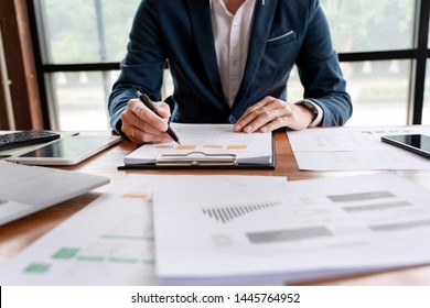 Strategy Analysis Concept, Businessman Working  Financial Manager Researching Process Accounting Calculate Analyse Market Graph Data Stock Information Review On The Table In Office