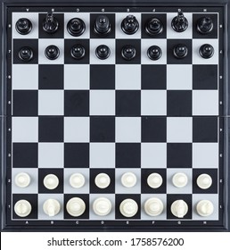 Strategy and chess concept with chess figures on checkerboard background top view. - Shutterstock ID 1758576200