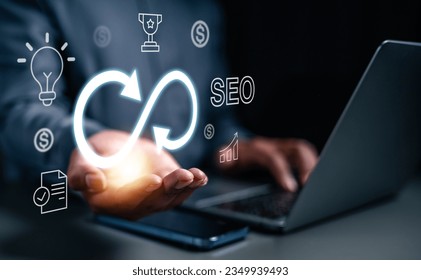 strategy, goal, success, target, aim, futuristic, marketing, performance, achievement, choose. typing at keyboard and then hand of palm holds the trophy, strategy, light bulb, target symbolic showing.