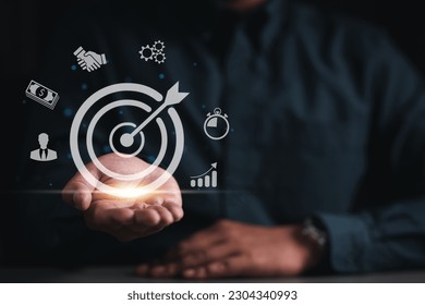 strategy, goal, success, target, social network, aim, futuristic, marketing, performance, achievement. at hand palm has bullseye. around that's social network target and strategy goal. aim and select.