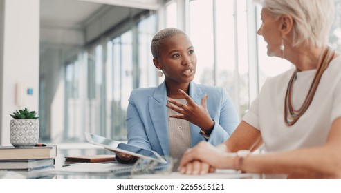 Strategy, tablet and women in discussion in business meeting for planning, communication and ideas. Teamwork, collaboration and female workers in conversation, speaking and talking about project - Shutterstock ID 2265615121