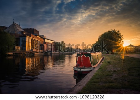 Stratford upon Avon river with Theatre and Narrowboat at sunrise