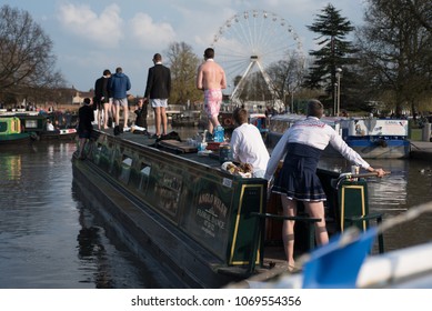 Stratford Upon Avon Warwickshire England UK April 14th 2018 Stag Party Revellers In Fancy Dress Drinking Alcohol And Driving A Boat Into The Canal Basin During A Warm Spell Of Weather 