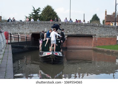 Stratford Upon Avon Warwickshire England UK April 14th 2018 Stag Party Revellers In Fancy Dress Drinking Alcohol And Driving A Boat Into The Canal Basin During A Warm Spell Of Weather 