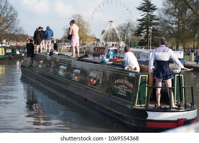 Stratford Upon Avon Warwickshire England UK April 14th 2018 Stag Party Revellers In Fancy Dress Drinking Alcohol And Driving A Boat Into The Canal Basin During A Warm Spell Of Weather 