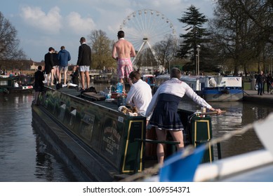 Stratford Upon Avon Warwickshire England UK April 14th 2018 Stag Party Revellers In Fancy Dress Drinking Alcohol And Driving A Boat Into The Canal Basin During A Warm Spell Of Weather 