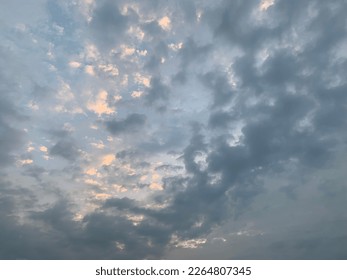 Stratocumulus clouds broken into rolls a rather lumpy appearance at cloud base with darker and lighter regions due to embedded weak convection at Bangkok,Thailand.no focus