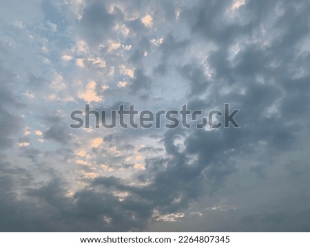 Stratocumulus clouds broken into rolls a rather lumpy appearance at cloud base with darker and lighter regions due to embedded weak convection at Bangkok,Thailand.no focus