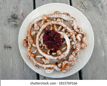 strauben, the typical Trentino dessert made of fried dough and forest fruit jam - Shutterstock ID 1815769166