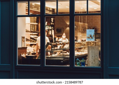 STRAUBING, GERMANY - Mar 09, 2022: A View Of Bakery Shop Workers From Outside