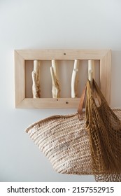 Straw Bag Mesh Bag On Handmade Wooden Hang. Concept Of Slowlife Home