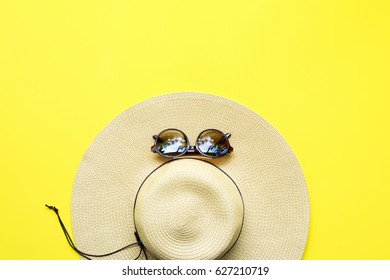 Straw Beach Woman's Hat Sun Glasses Top View Yellow Background Flat Single