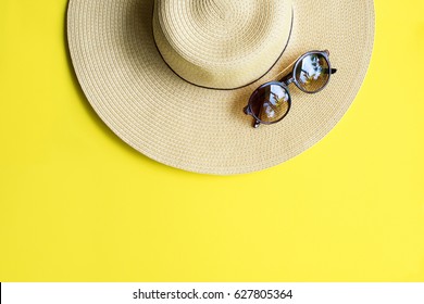 Straw Beach Woman's Hat Sun Glasses Top View Yellow Background Flat Single