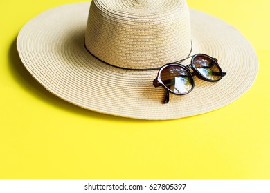 Straw Beach Woman's Hat Sun Glasses Top View Yellow Background Flat Single