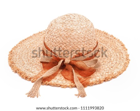 Straw beige Lady hat with ribbon and bow isolated on white background.