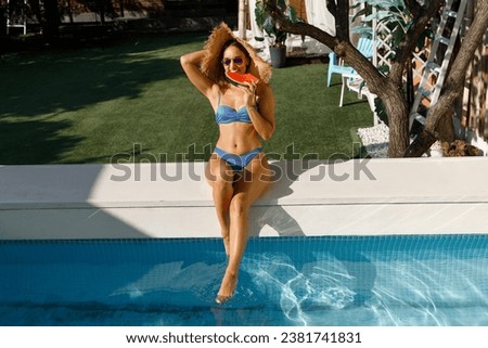 Similar – Brunette surfer woman with top and bikini holding surfboard