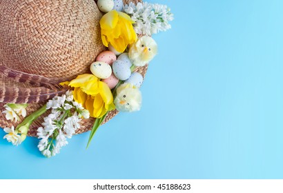 Straw Hat Decorated For Easter With Flowers, Chicks And Easter Eggs