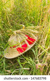 straw hat and ears of wheat