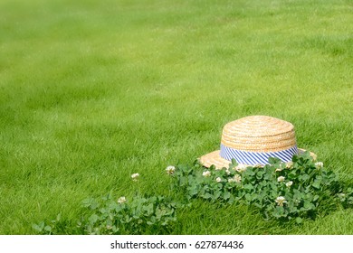 Straw hat in the green fields
